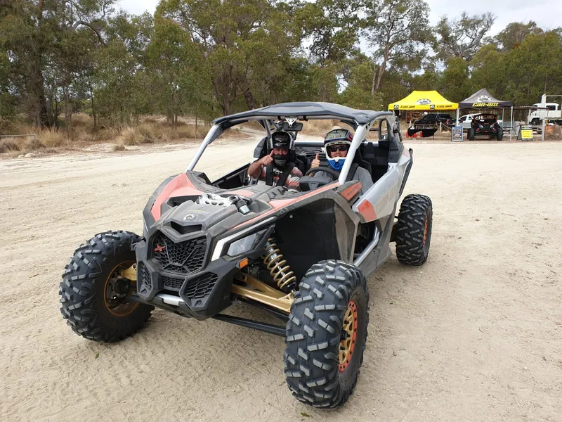 Passenger giving thumbs up after a dune ride